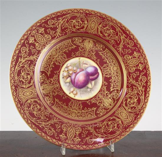 A Royal Worcester fruit painted crimson ground plate, mid 20th century, 27cm (10.4in.)